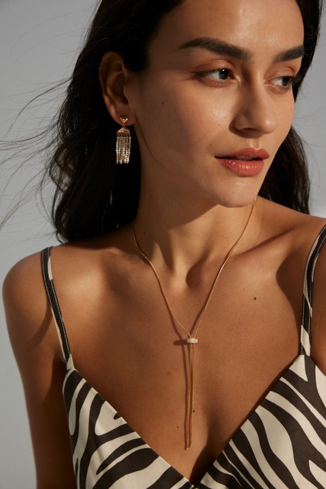 Handcrafted S925 sterling silver necklace featuring sparkling zirconia accents against a vintage gold or vintage gold with platinum finish. The adjustable 65cm chain allows for versatile styling, perfect for achieving a shorter, layered look or a dramatic, elongated style. 