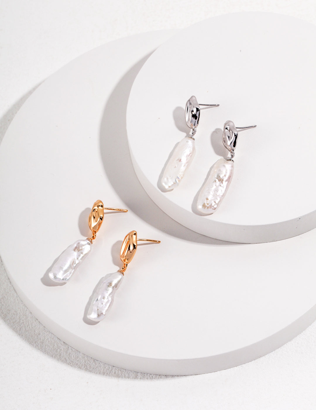 Sterling Silver Baroque Pearl Earrings made from S925 silver, featuring irregularly shaped natural baroque pearls. Approximately 44mm high and 12mm wide, available in white gold or vintage gold finishes, these earrings offer a sophisticated and elegant accessory.