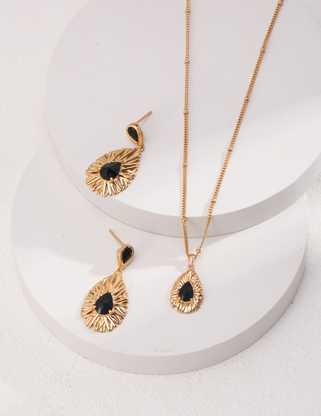 Black Palace Style earrings crafted from 925 sterling silver with a vintage gold finish, featuring striking black zirconia stones. Measuring approximately 3cm high and 1.5cm wide, these earrings blend modern elegance with vintage charm, perfect for both formal occasions and chic nights out.