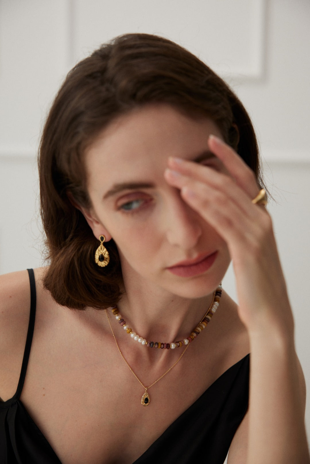 Black Palace Style earrings crafted from 925 sterling silver with a vintage gold finish, featuring striking black zirconia stones. Measuring approximately 3cm high and 1.5cm wide, these earrings blend modern elegance with vintage charm, perfect for both formal occasions and chic nights out.