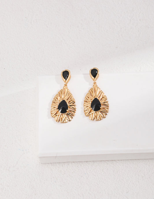 Black Palace Style earrings crafted from 925 sterling silver with a vintage gold finish, featuring bold black zirconia stones. Measuring approximately 3cm high and 1.5cm wide, these earrings offer a sophisticated blend of contemporary design and classic charm, perfect for formal events or chic everyday wear.