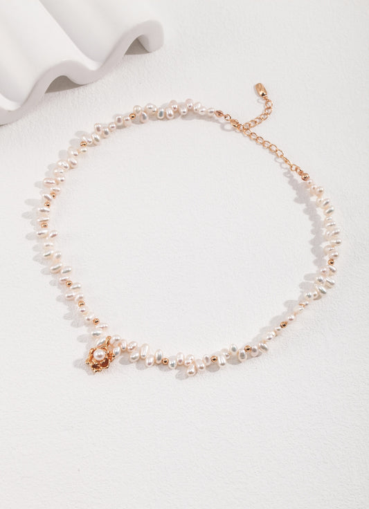 Chic camellia pendant necklace crafted from S925 silver with a vintage gold finish. The necklace features a 38cm chain with a 6cm extension and a beautifully detailed camellia pendant measuring 12.5mm in height, 12mm in width, and 5mm in thickness, adorned with 3mm to 4mm pearls. 