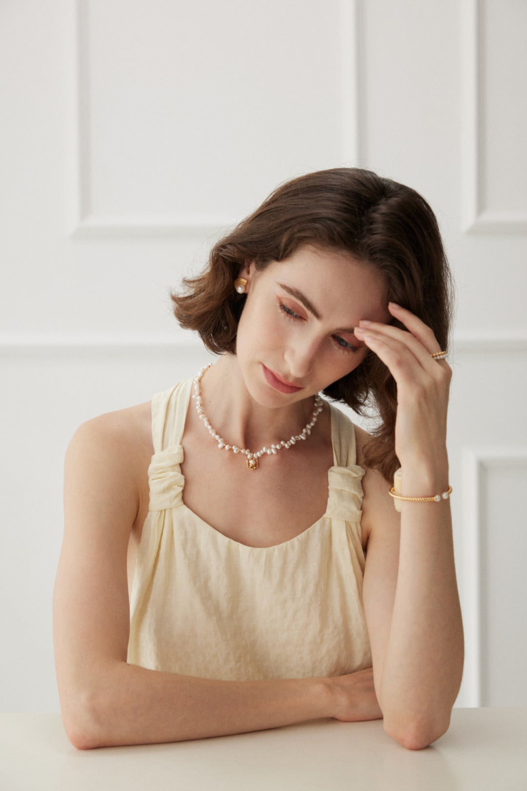 Chic camellia pendant necklace crafted from S925 silver with a vintage gold finish. The necklace features a 38cm chain with a 6cm extension and a beautifully detailed camellia pendant measuring 12.5mm in height, 12mm in width, and 5mm in thickness, adorned with 3mm to 4mm pearls. 