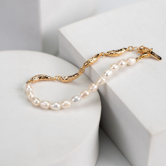 Elegant Half Pearl Half Gold Natural Pearl Bracelet crafted from S925 silver and natural pearls, finished in vintage gold. The bracelet measures approximately 16.5cm with a 4cm extension chain. Each pearl is about 5mm in size, while the silver accents are approximately 3mm x 4mm. This delicate design alternates between pearls and silver pieces, offering a perfect balance of classic charm and modern sophistication.
