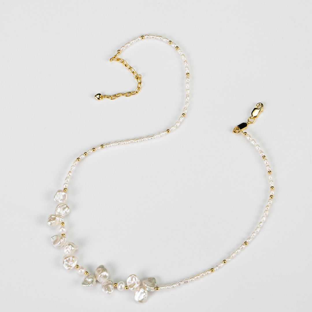 Sterling silver necklace featuring stone-shaped baroque pearls, inspired by morning dew. Crafted with S925 silver and K gold finish, with rice pearls and baroque pearls for a dreamlike elegance.