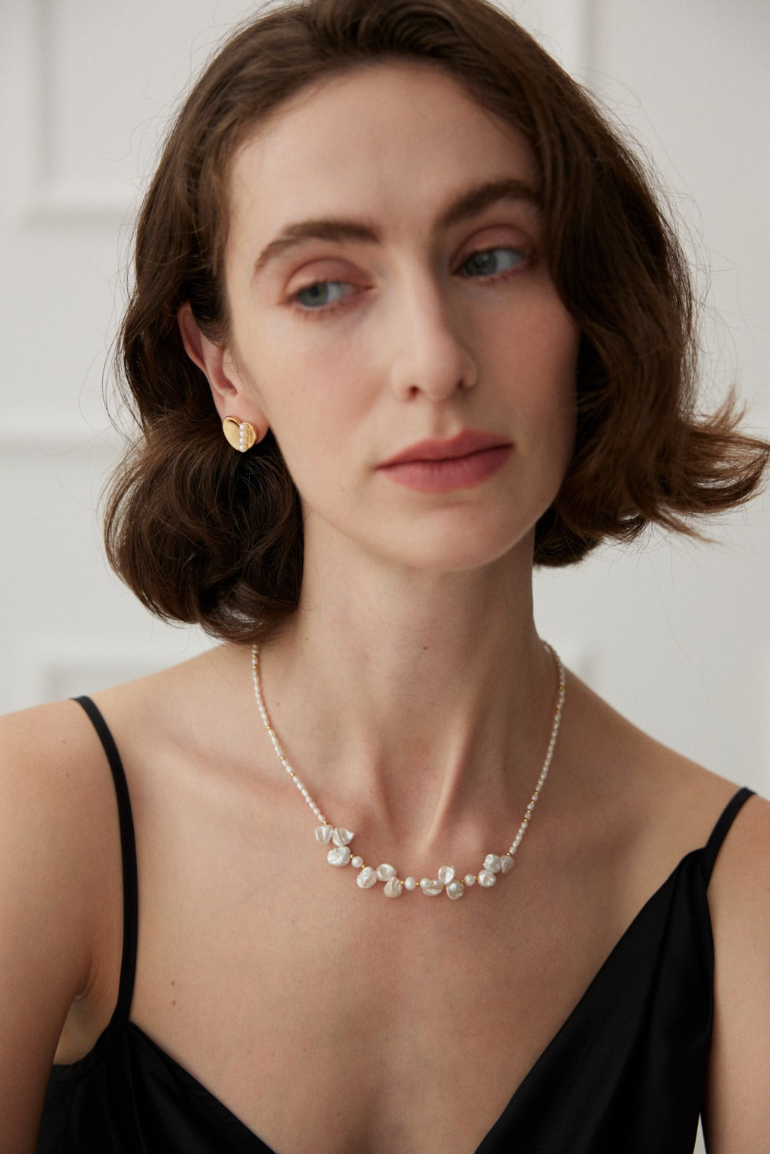 Sterling silver necklace featuring stone-shaped baroque pearls, inspired by morning dew. Crafted with S925 silver and K gold finish, with rice pearls and baroque pearls for a dreamlike elegance.