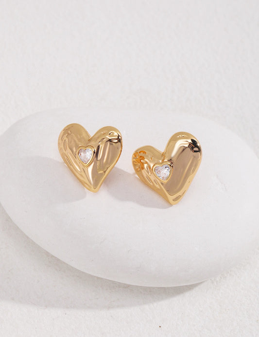 Charming Sterling Silver Heart Zircon Earrings made from high-quality 925 silver with a vintage gold finish. Each earring measures approximately 1.8cm and features a playful heart design adorned with sparkling zirconia, perfect for adding a touch of charm and elegance to any outfit for casual or special occasions.