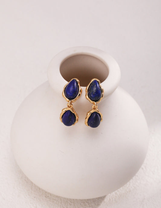 Sterling silver earrings with vintage gold finish, featuring 8mm wide lapis lazuli stones in a 2.7cm tall design. These elegant earrings highlight the deep royal blue of lapis lazuli, adding a regal touch to both casual and formal outfits. Crafted from high-quality 925 silver, the compact design exudes sophistication and timeless beauty.