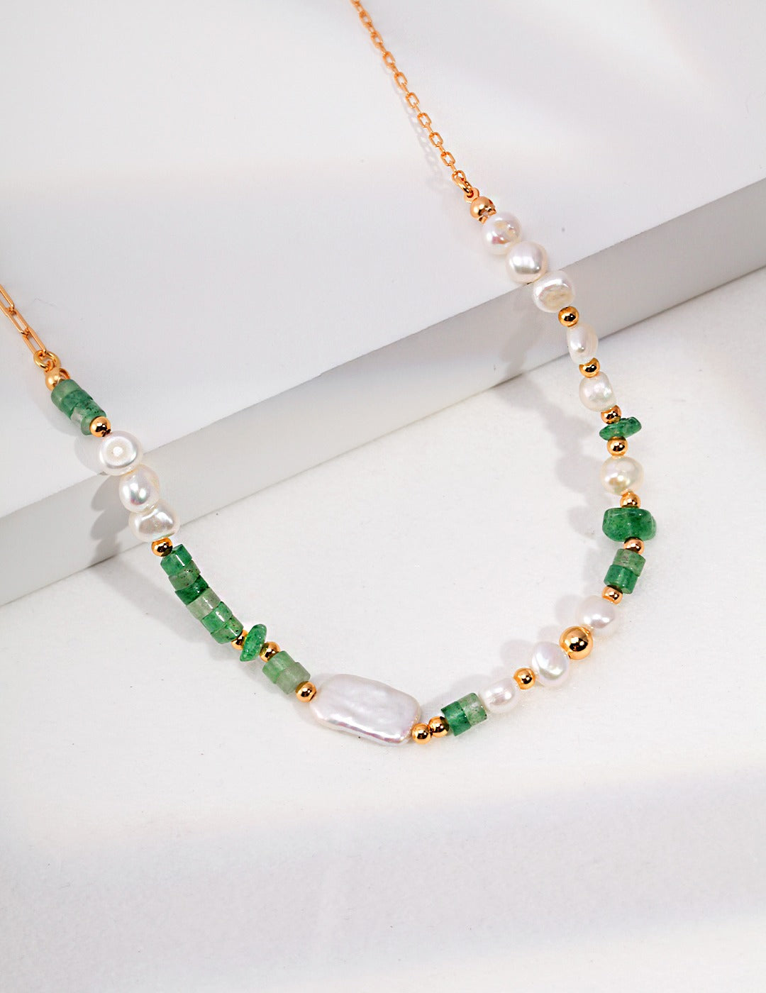 Sterling Silver Pearl Necklace featuring natural pearls, aventurine, and green strawberry crystal gravel. Crafted from S925 silver with a vintage gold finish, it has an adjustable chain length of 38cm plus a 6cm extension, perfect for layering or wearing alone.