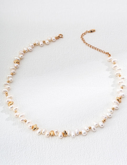 Baroque pearl necklace crafted from 925 silver with a vintage gold finish, featuring 4-7mm natural pearls. The necklace is 36cm long with a 6cm extension chain, blending vintage charm with contemporary design, perfect for casual wear or special occasions.