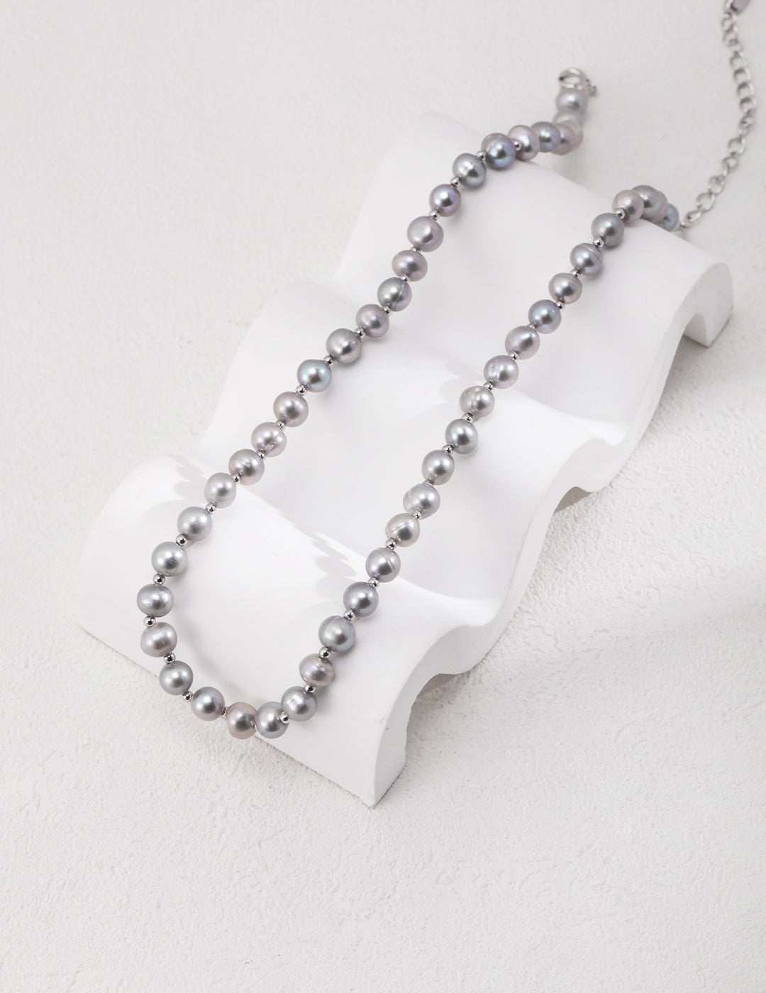 Elegant necklace crafted from high-quality 925 silver and finished in white gold, featuring a lustrous natural pearl approximately 6.3mm in size. The chain length is 37cm with a 7cm extension, allowing for an adjustable fit suitable for any occasion.